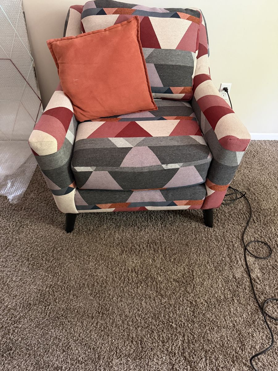 Geometric Pattern Accent Chair with Orange Throw Pillow
