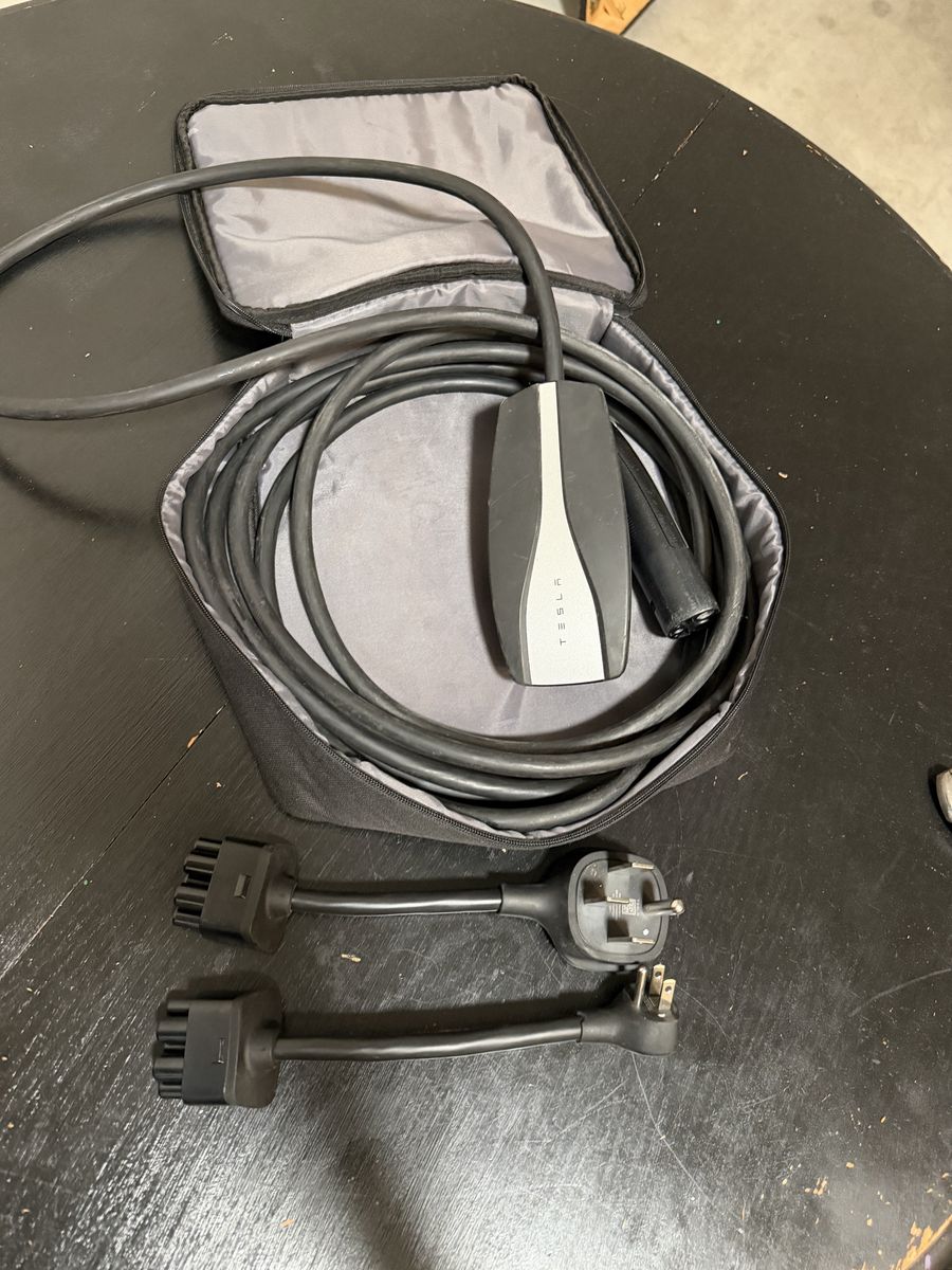 Tesla Mobile Connector EV Charger with NEMA 5-15 and NEMA 14-50 Adapters.
