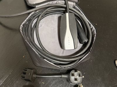 Tesla Mobile Connector EV Charger with NEMA 5-15 and NEMA 14-50 Adapters.