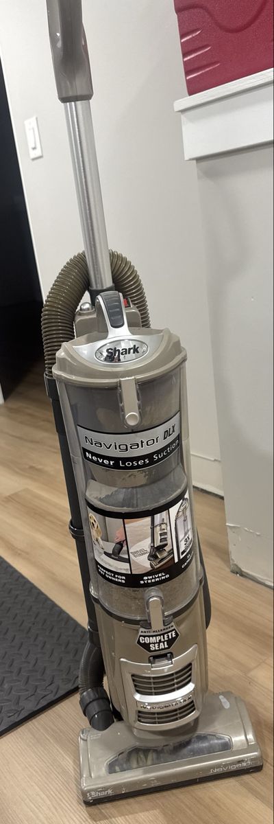 Shark Navigator DLX Upright Vacuum Cleaner - Never Loses Suction - Bagless, Complete Seal