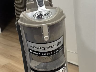 Shark Navigator DLX Upright Vacuum Cleaner - Never Loses Suction - Bagless, Complete Seal