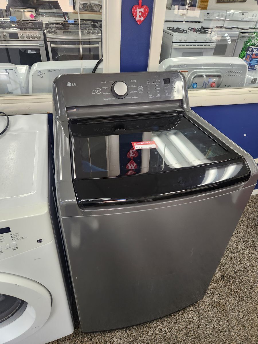 BEAUTIFUL LG HE TOPLOAD WASHER! WITH A FULL WARRANTY