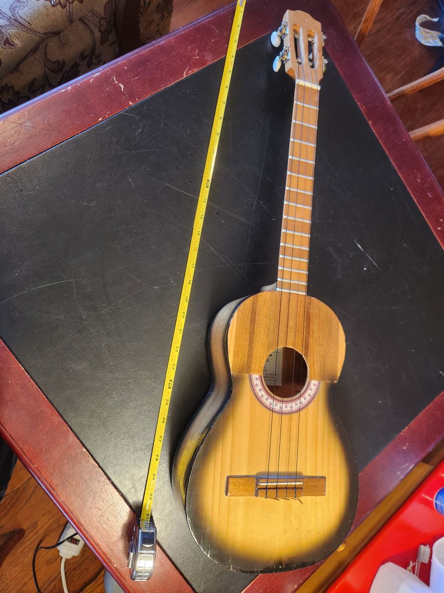 31 inch Baritone Ukulele, Felix Sanchez, "Fabrica de Cuatros, El Larense Sanshez", very unusual.  Sounds great and looks cool.
