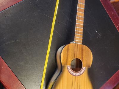 31 inch Baritone Ukulele, Felix Sanchez, "Fabrica de Cuatros, El Larense Sanshez", very unusual. Sounds great and looks cool.