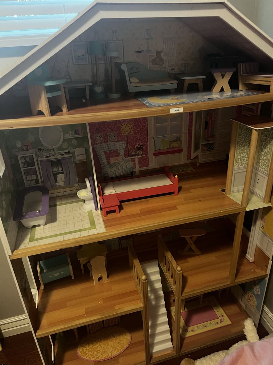 Large Wooden Dollhouse with Multiple Rooms, Stairs, and Furniture