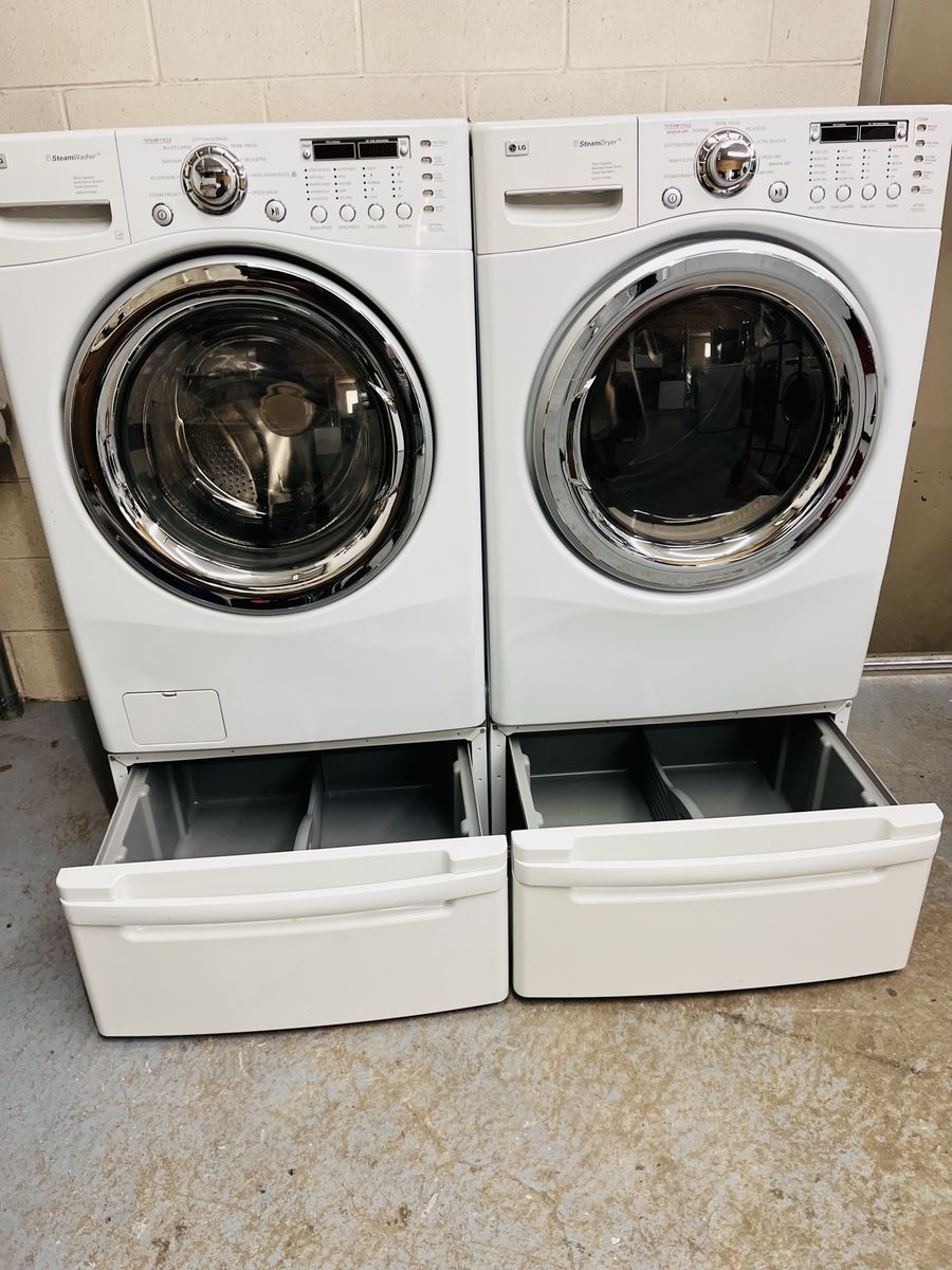 LG washer and dryer set with pedestals
