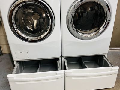 LG washer and dryer set with pedestals