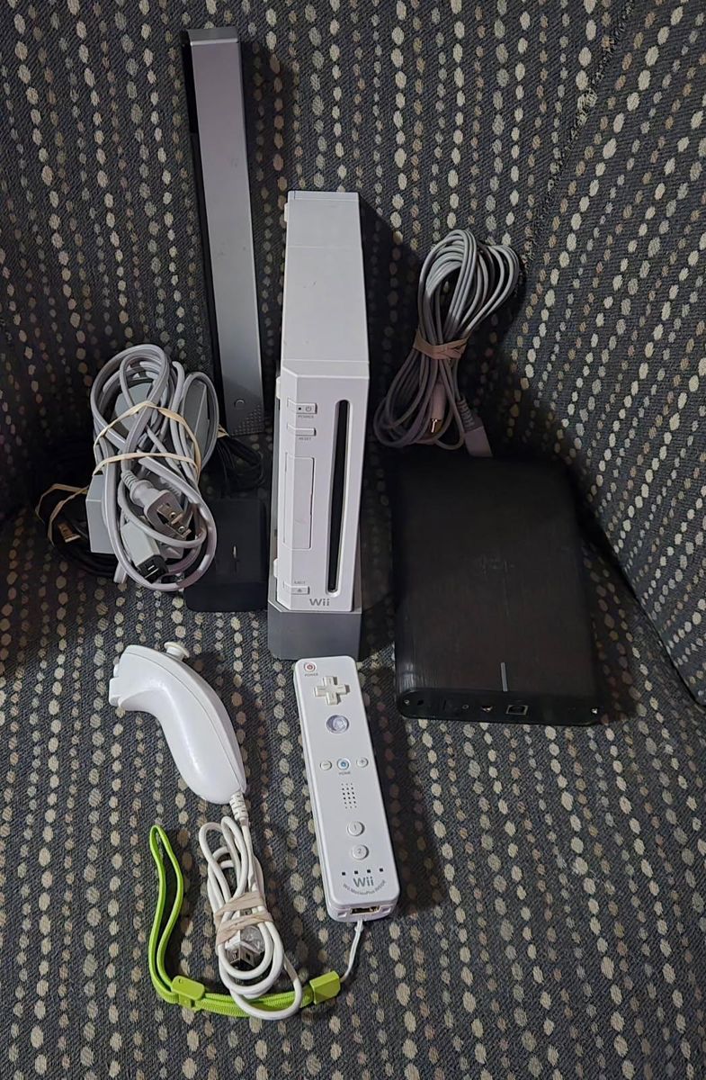 Backwards compatible Nintendo Wii with motionplus controller Homebrew and 750gb hard drive! Trades considered!