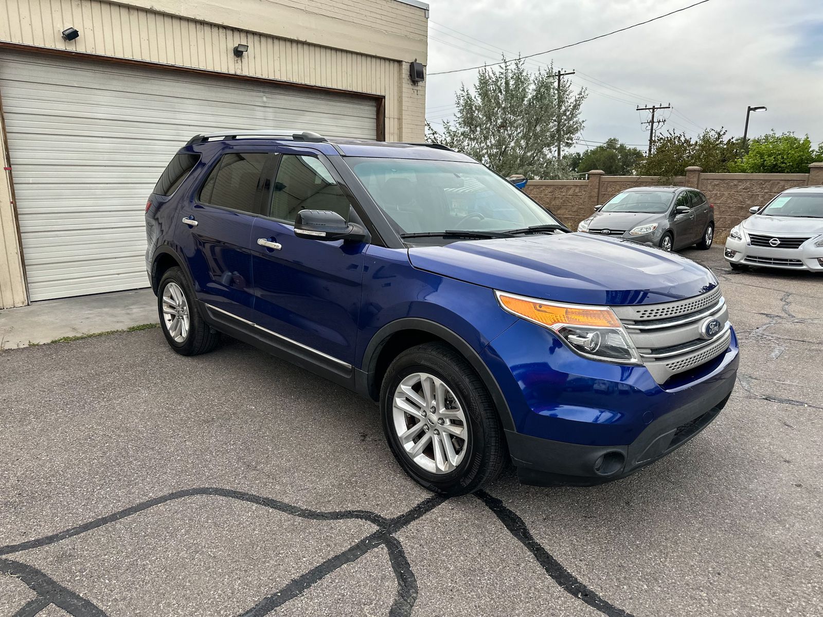 2015 Ford Explorer XLT — rebuilt & branded title, 28% below market