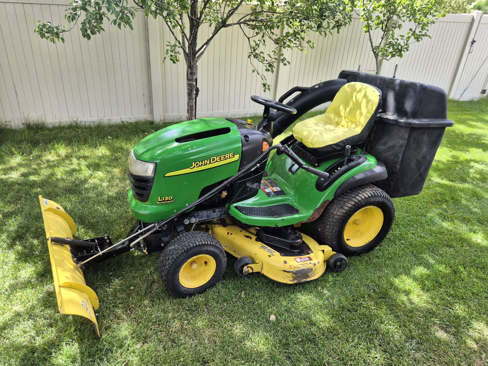 John Deere Riding Mower with bags and plow