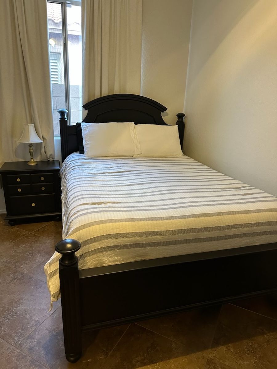 Blackwood Queen bed frame. Box springs and mattress included. Throw in bedding if wanted as well.