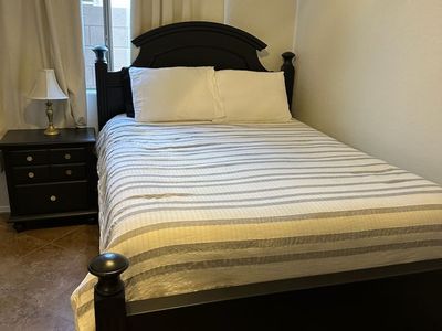 Blackwood Queen bed frame. Box springs and mattress included. Throw in bedding if wanted as well.