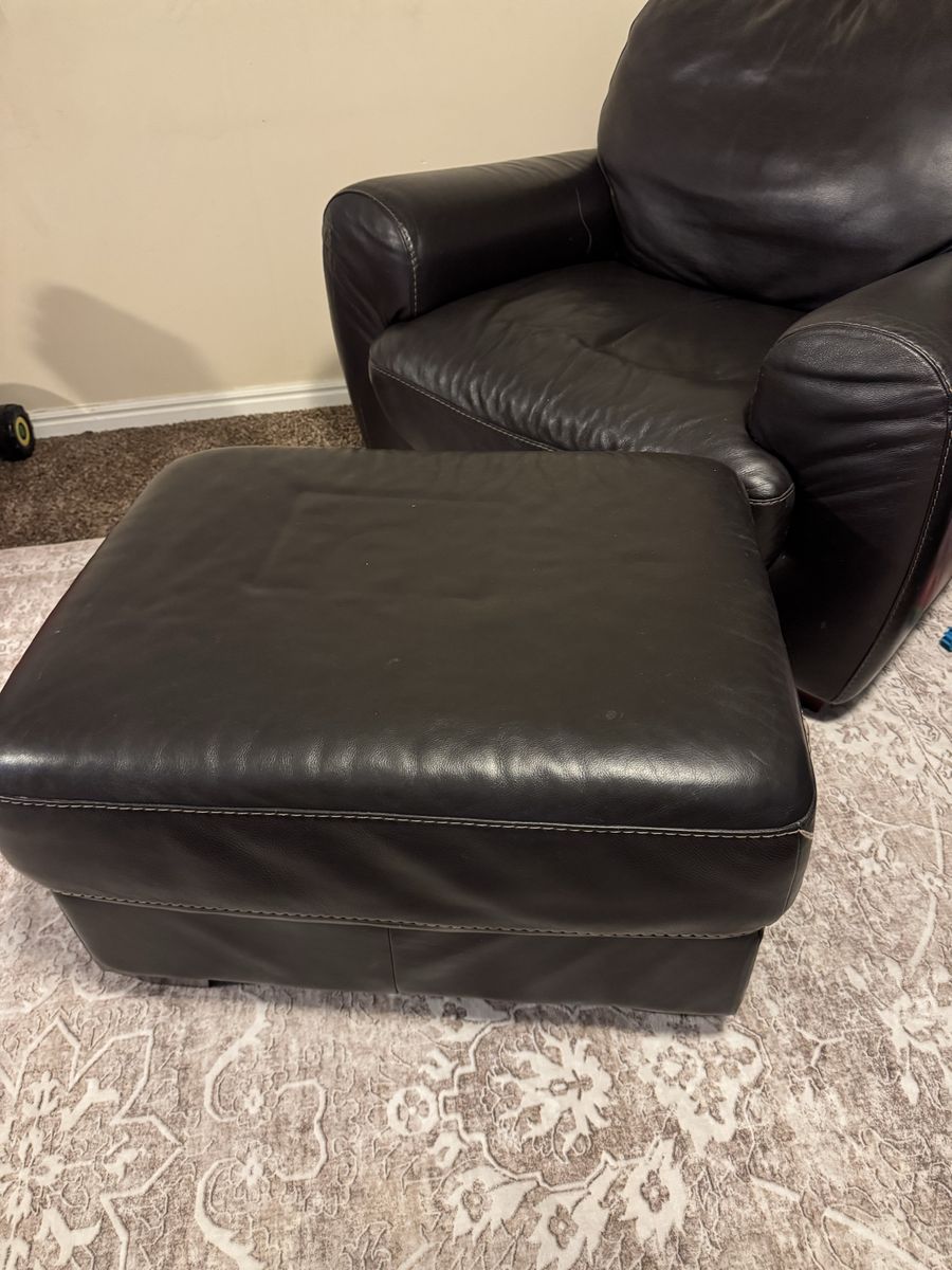 2 arm chairs either ottomans