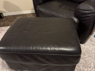 2 arm chairs either ottomans