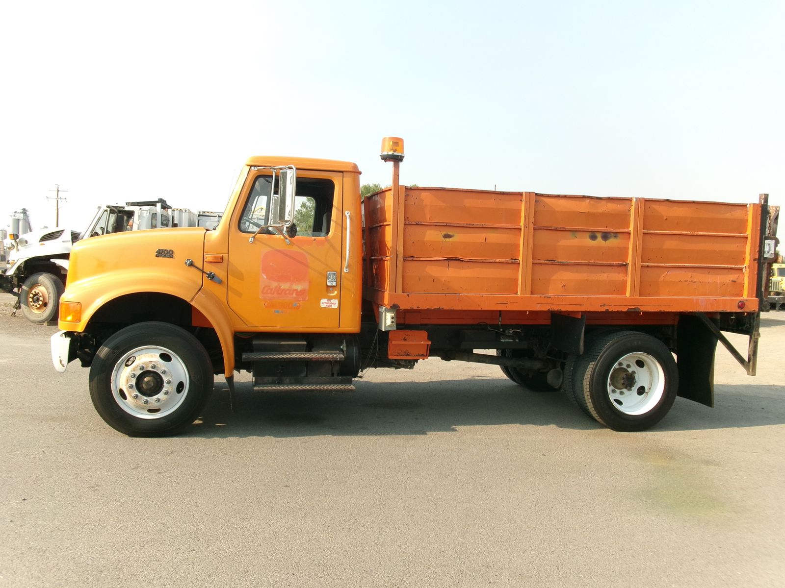 1995 IHC 4700 with 12 ft. flatbed and liftgate