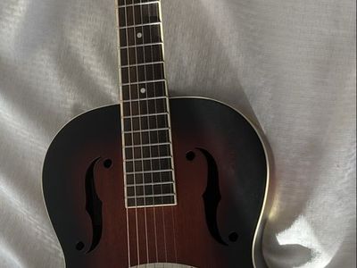 Gretsch G9220 Bobtail round neck resonator guitar with Gator GW-JM Reso Journeyman case and accessories.