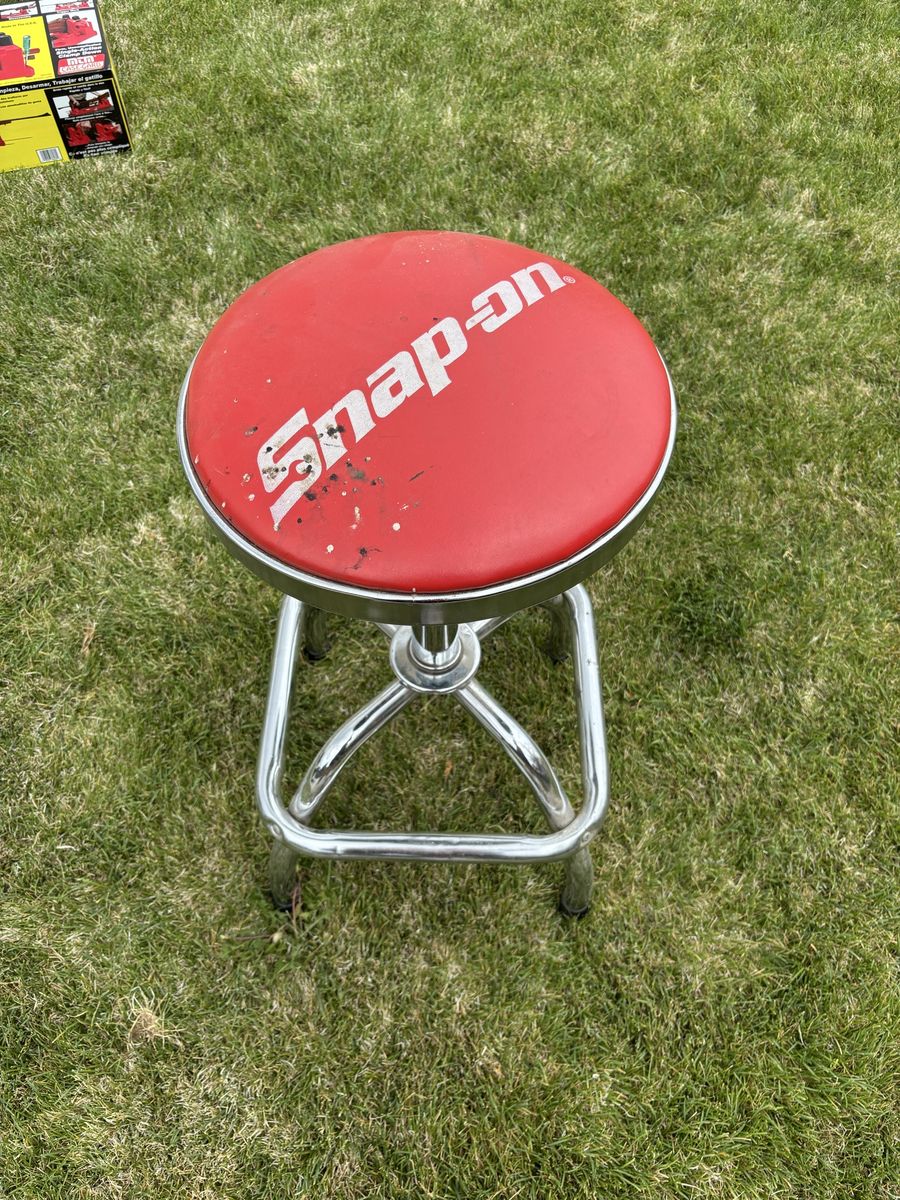 Snap-on adjustable swivel shop stool with chrome frame and footrest