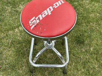 Snap-on adjustable swivel shop stool with chrome frame and footrest