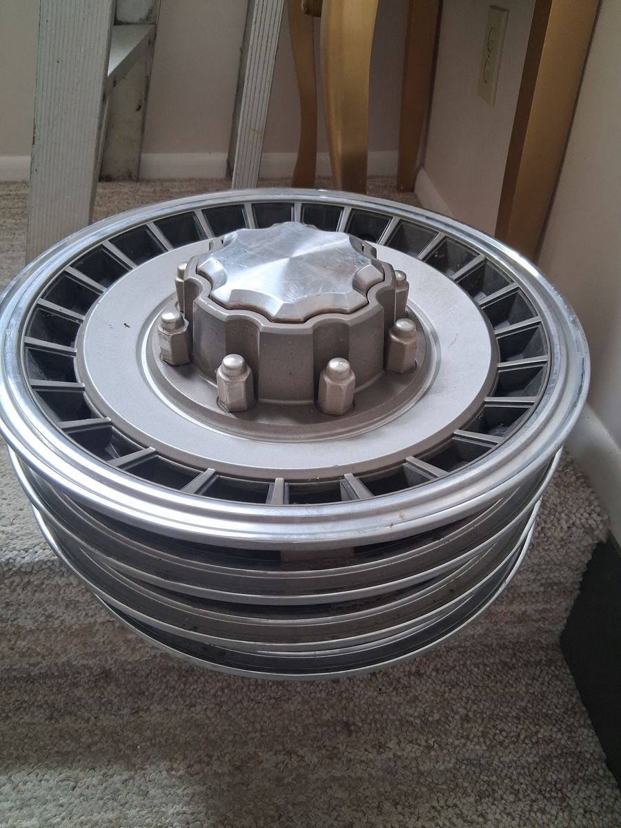 Set of older Ford truck hubcaps