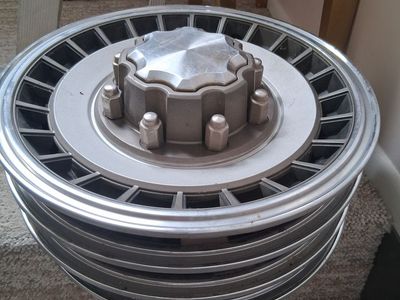 Set of older Ford truck hubcaps