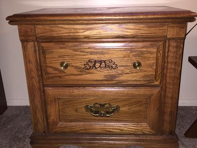 Oak Two-Drawer Nightstand with Brass Hardware and Carved Acorn Details