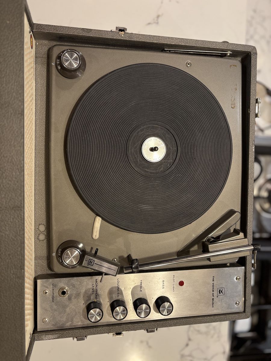 Works great! Vintage portable record player for vinyl records. Mid Century Modern styling Voice of Music