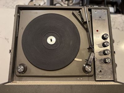 Works great! Vintage portable record player for vinyl records. Mid Century Modern styling Voice of Music
