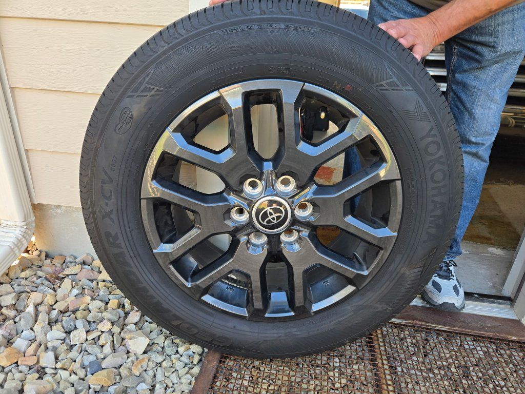 4 Yokohama Geolandar X-CV tires and wheels