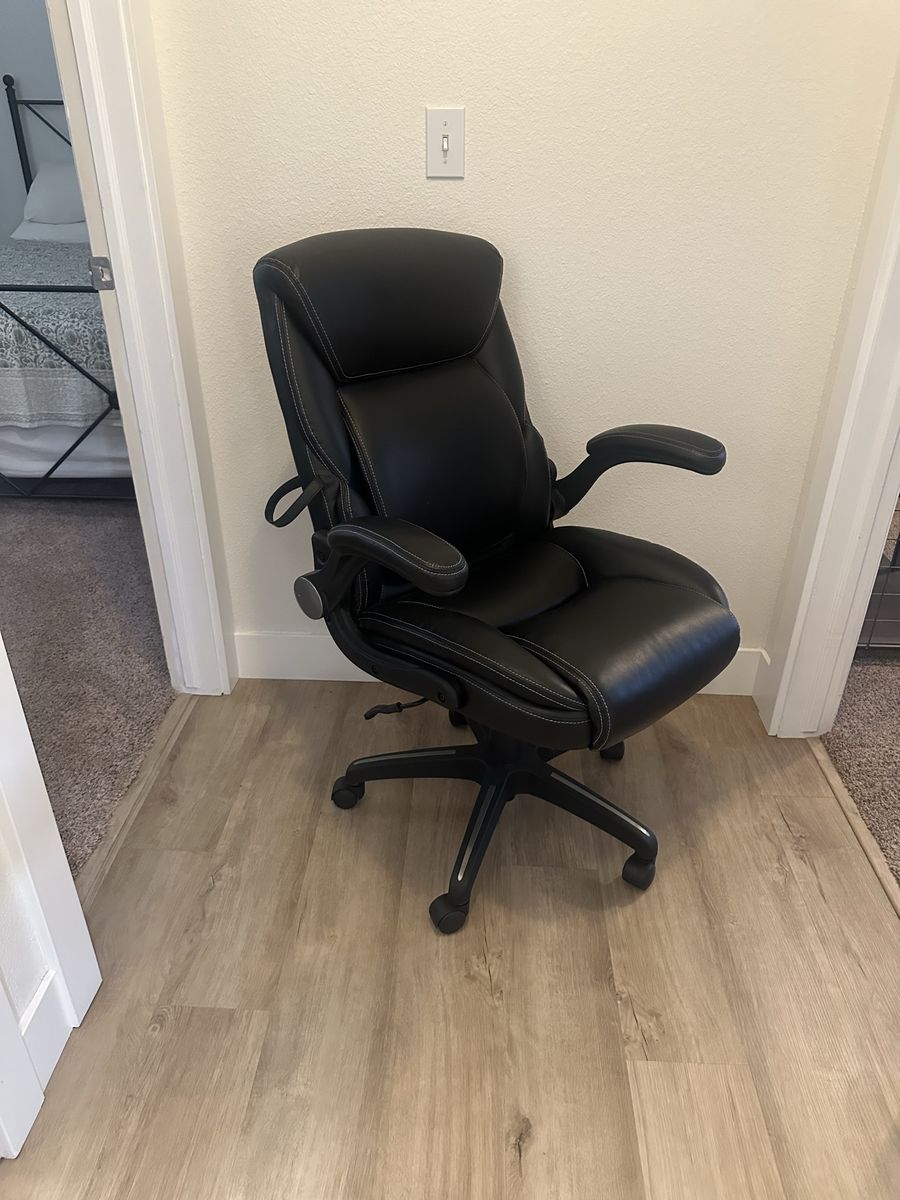 Serta Black Faux Leather Executive Office Chair with Flip-Up Armrests