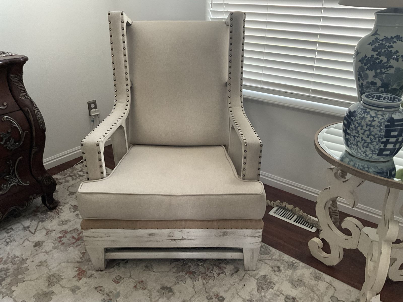 Distressed Wood Wingback Accent Chair with Beige Upholstery and Nailhead Trim