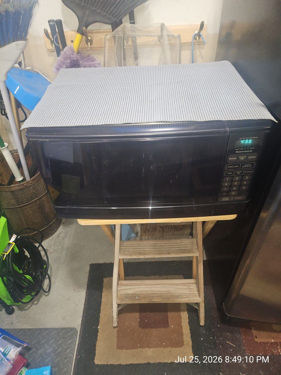 Kenmore Black Countertop Microwave Oven - Fully Functional & Clean Interior with digital control panel.