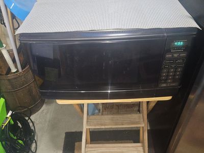 Kenmore Black Countertop Microwave Oven - Fully Functional & Clean Interior with digital control panel.