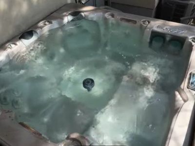 Elite Spas 8x8 Hot Tubs - 2 available with different Synthetic Cabinets - 1 has a Mahogany Cabinet the other has a Light Redwood