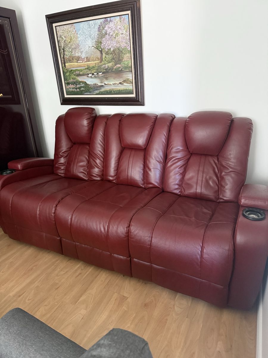 Red Leather Reclining Sofa with Cup Holders. Electric