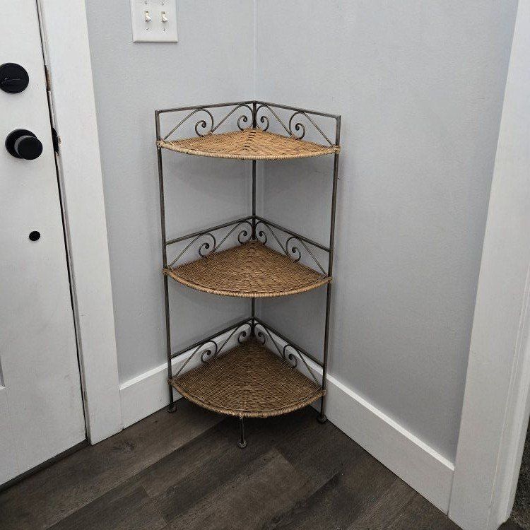 3 tiered wicker-metal frame corner shelf.