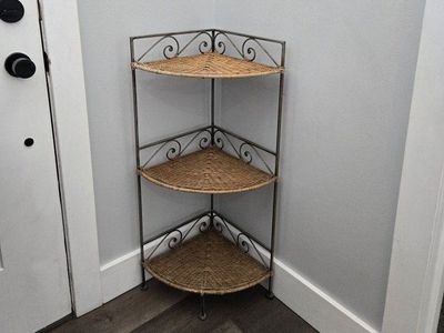 3 tiered wicker-metal frame corner shelf.