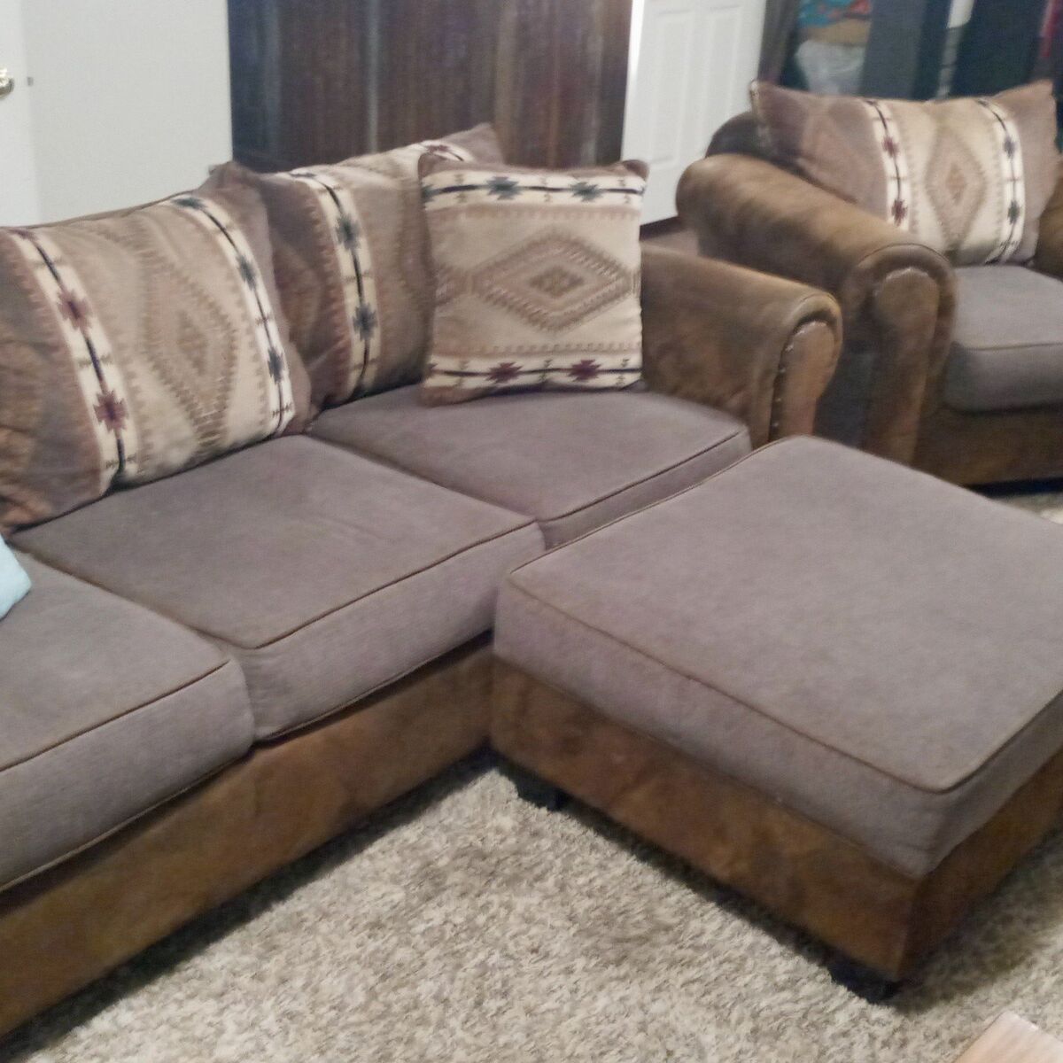 partial leather and native print couch and chair