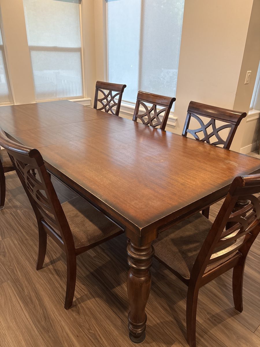 Solid wood dining room table with leaf and 8 chairs
