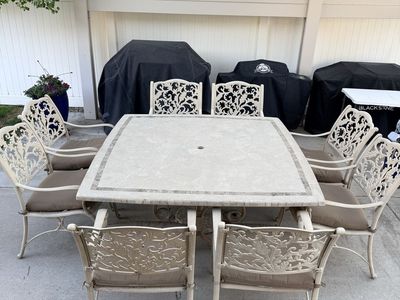 8-Piece Outdoor Patio Dining Set - Stone Top Table & 8 Cast Aluminum Armchairs