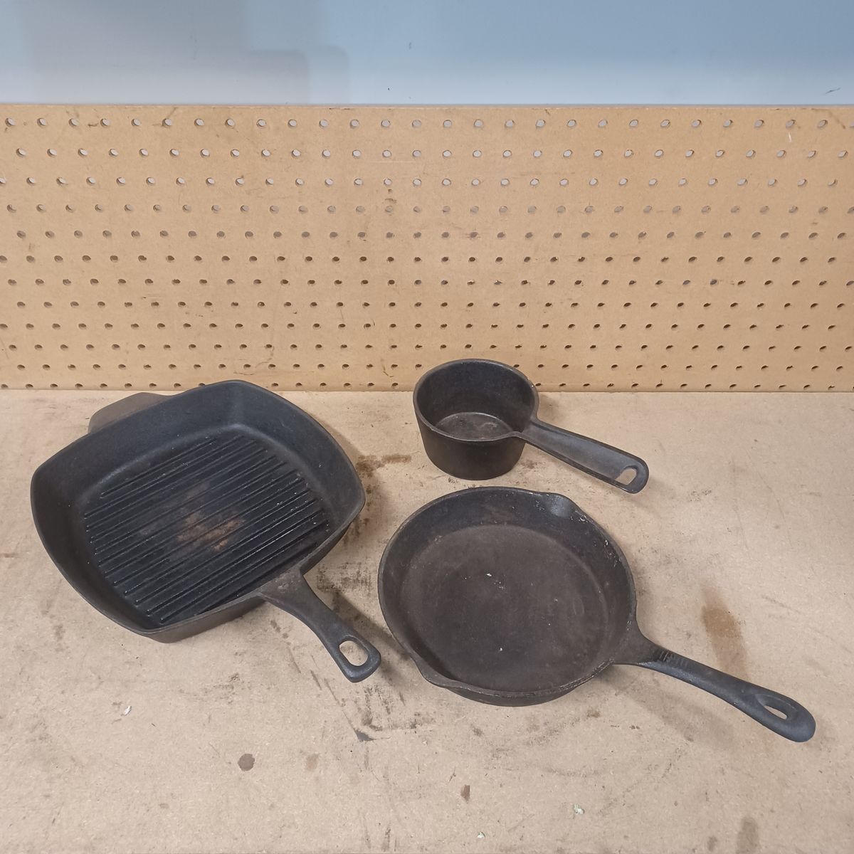 Cast iron skillets and cup