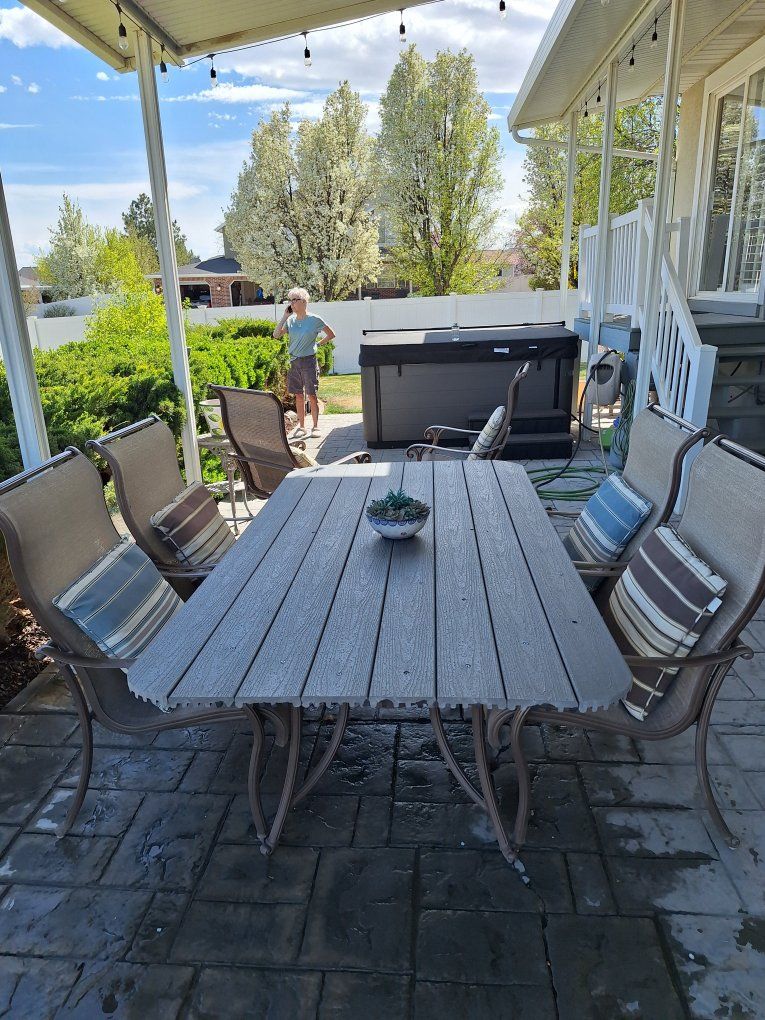HUGE PATIO TABLE WITH 4 CHAIRS AND TWO SWIVEL ROCKERS