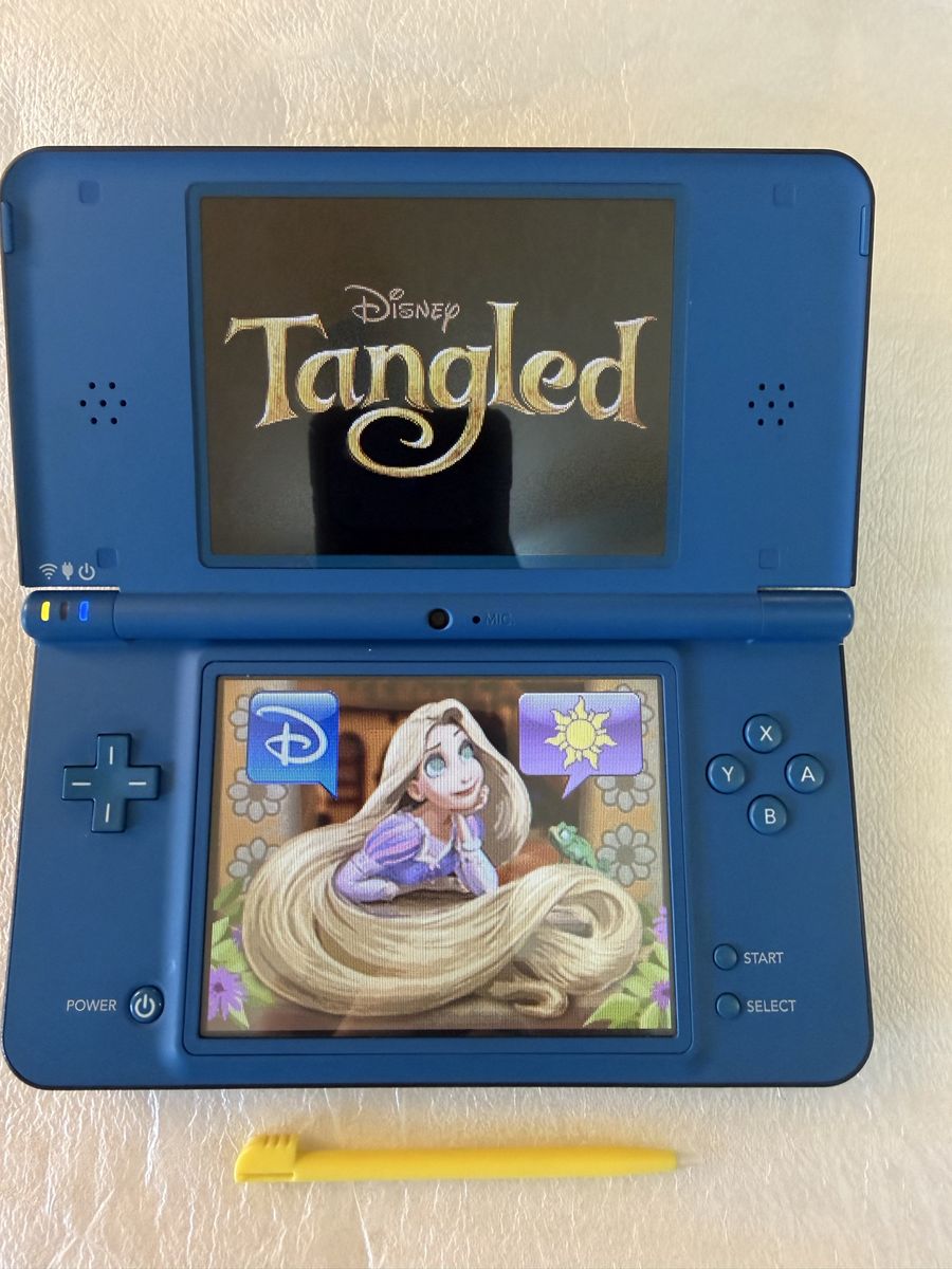 Nintendo DSi XL Blue Handheld Console comes with charger and Stylus and Brain age Art and Math game download to device.