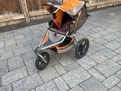 BOB Revolution Single Jogging Stroller - Orange/Gray, Air-Filled Tires, Reclining Seat, Hand Brake