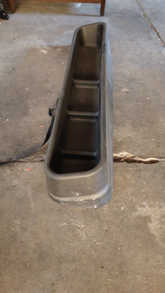 Under rear seat storage