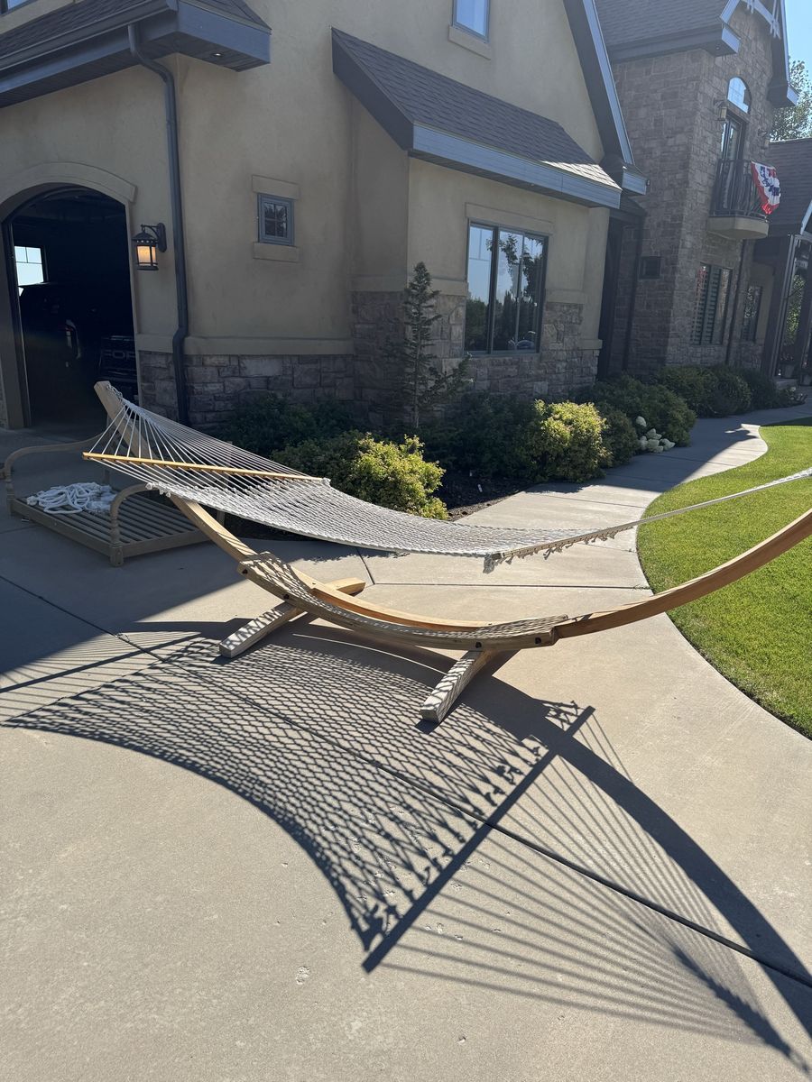 Outdoor Wooden Arc Hammock Stand with White Rope Hammock. Can be disassembled for transport.