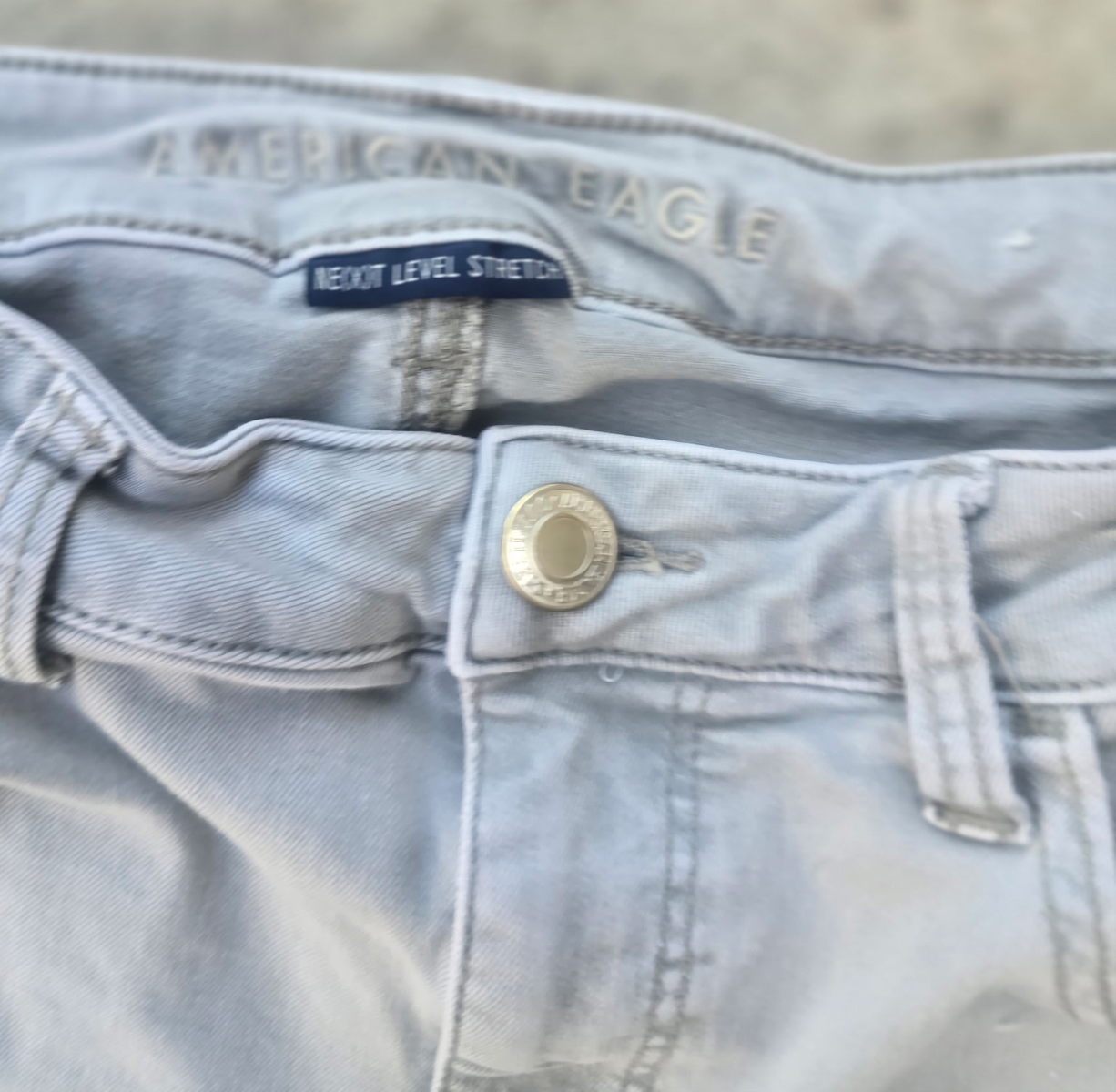 American Eagle Next Level Stretch Distressed Skinny Jeans – Light Gray Wash