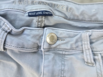 American Eagle Next Level Stretch Distressed Skinny Jeans – Light Gray Wash
