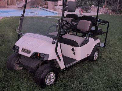 EZGO 4-Passenger Golf Cart with Roof, Folding Windshield & Rear Bench