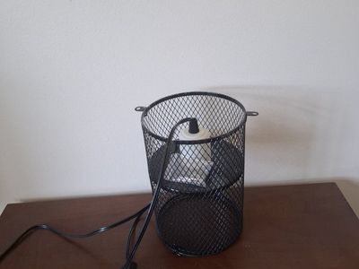 Wire cage for Reptile basking bulb or heat emitter. I paid $22 never ended up installing it.
