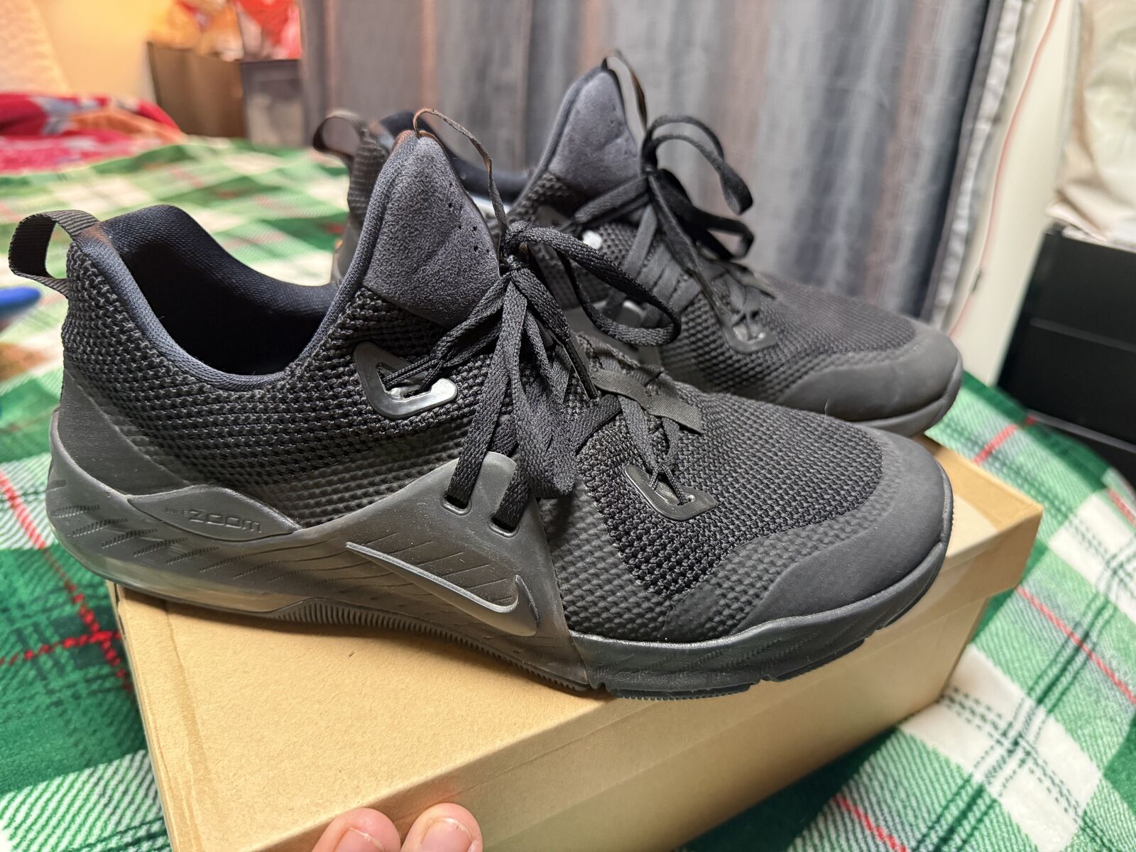 Triple black Nike shoes